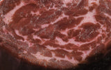 Close-up of raw beef with marbling